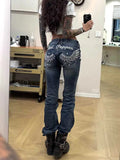 Zynvora Low-Rise Embroidered Skinny Jeans